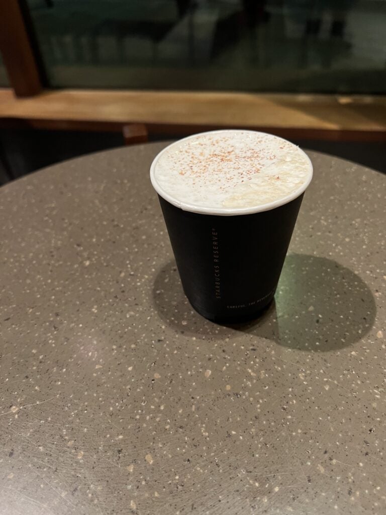 Small cup of coffee with cold foam on top