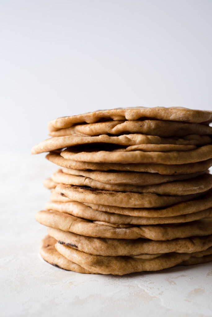 Stack of naan breads from the side