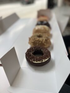 Oblong box of 6 donuts all in a line