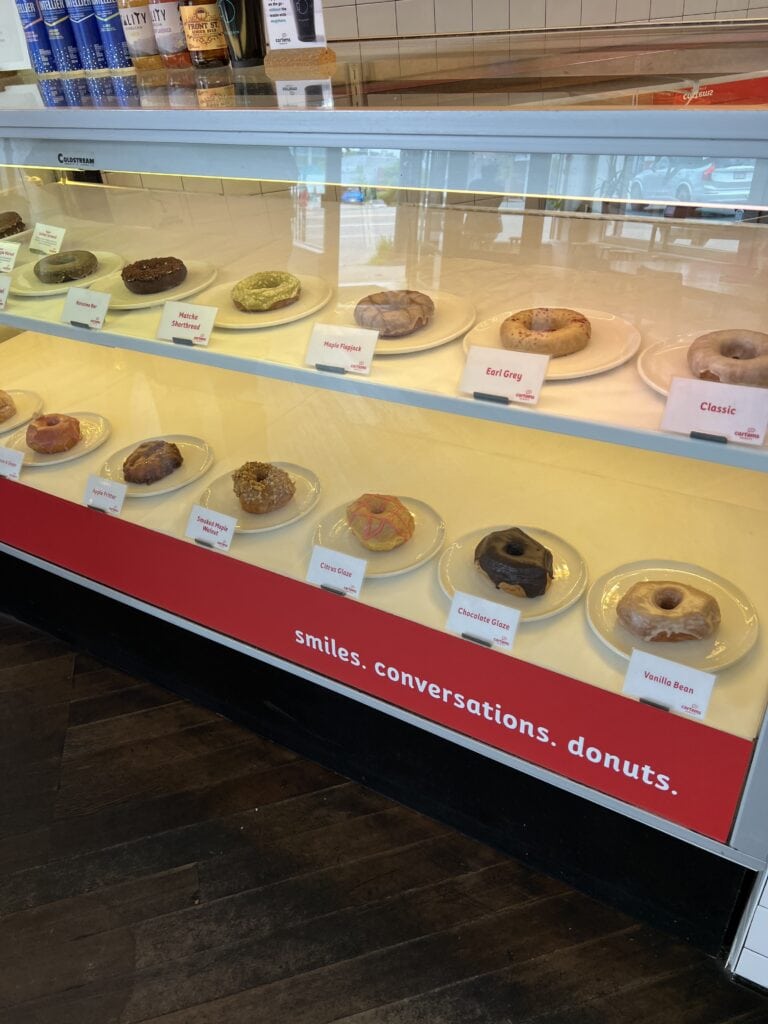 Glass display case filled with donuts