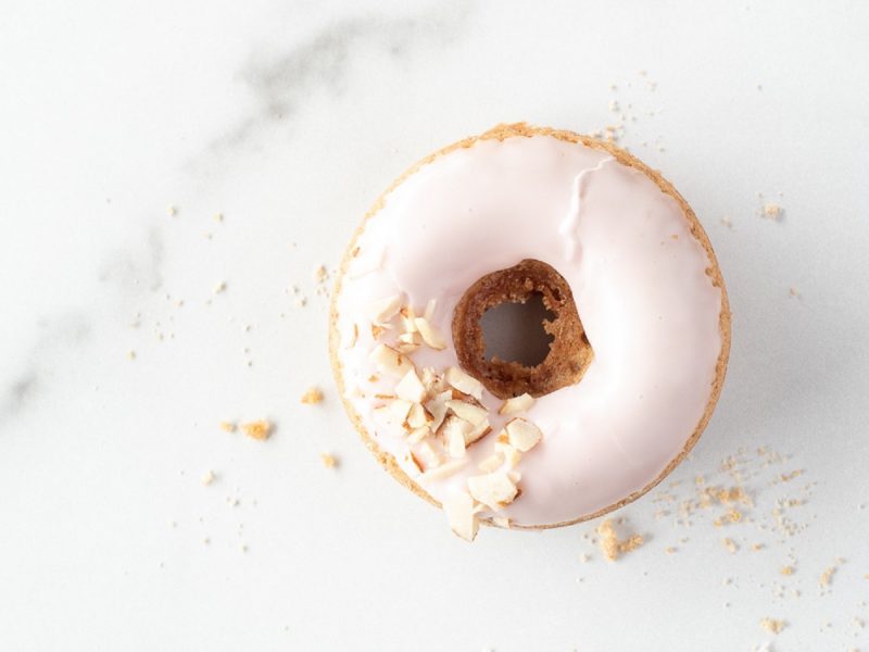 Close up view of the top of a pink donut