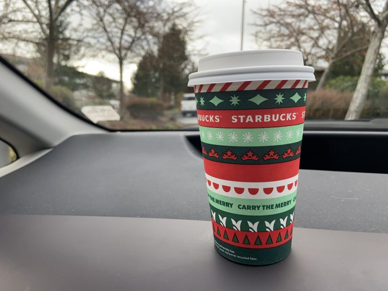 Starbucks cup on a dashboard of a car
