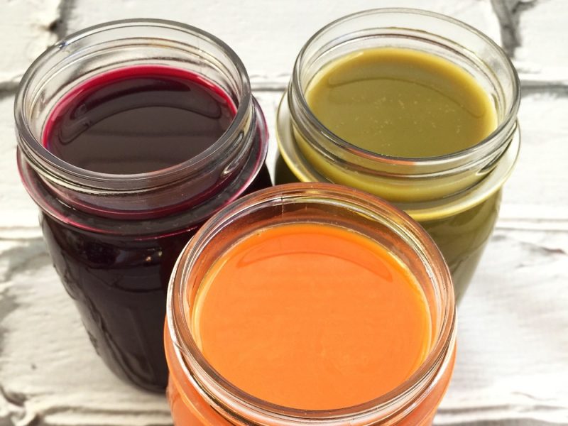 3 jars of colorful fruit juice