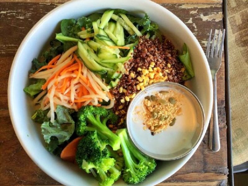 Top down view of a large bowl of veggies and rice