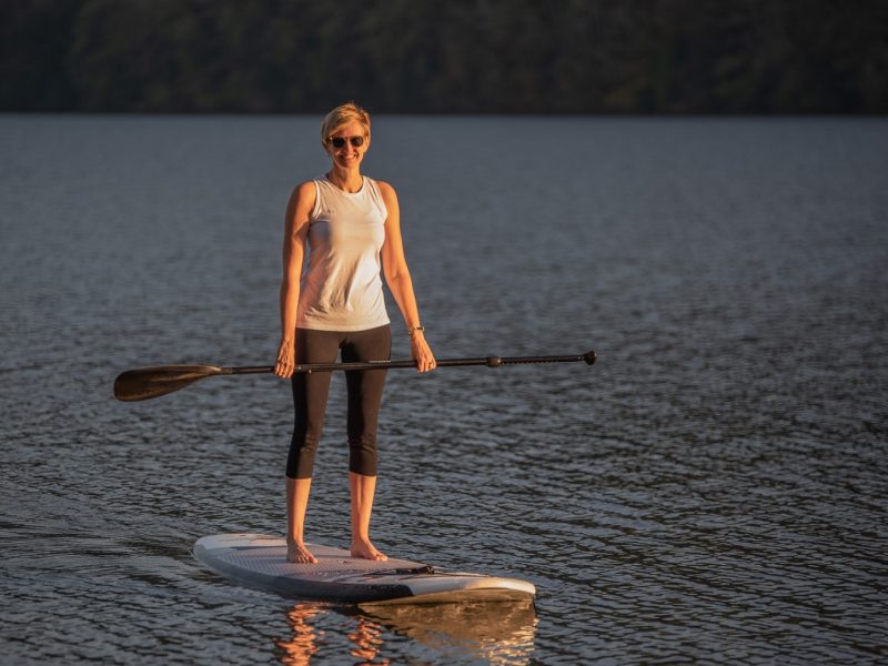 Woman on a paddle board in a lake