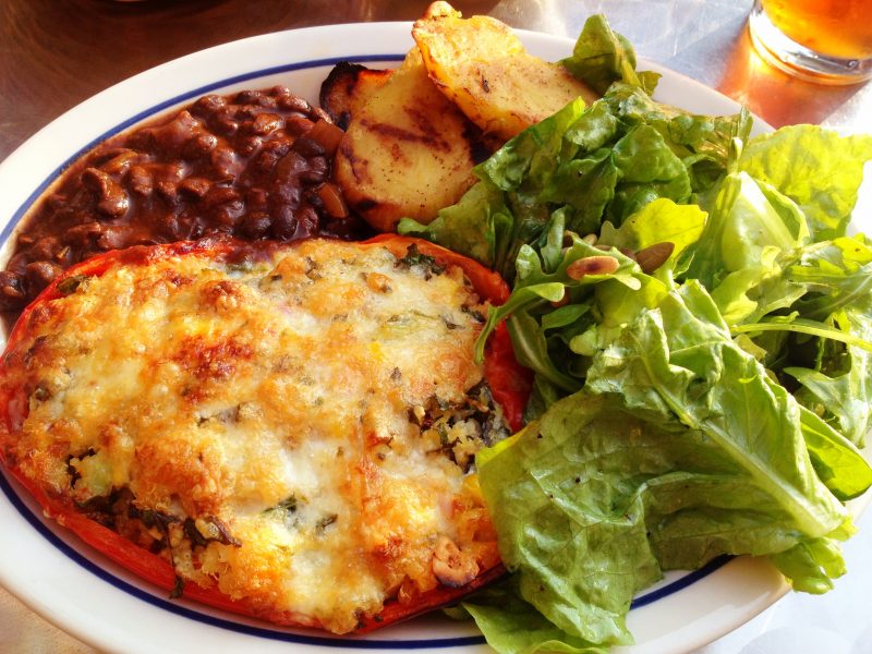 Quinoa-stuffed red pepper with smoked mozzarella, corn, cashews, goat cheese and a medley of vegetables.  Comes with tossed green salad, black beans and chipotle-grilled sweet potatoes.