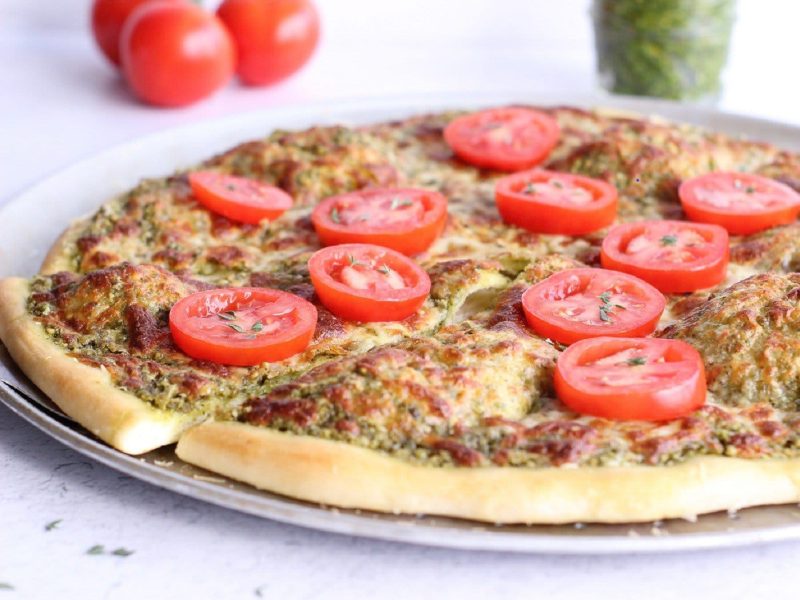 Pizza with tomatoes on top
