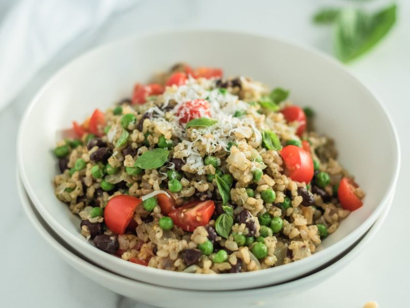 Close up of a white bowl filled with rice and beans